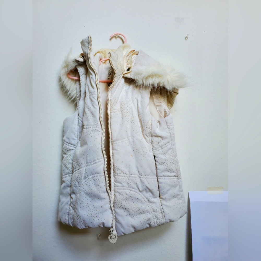 A white and gold dot jacket